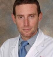 MATHIEU SERTORIO WITH UC LAB COAT   RAD/ONC